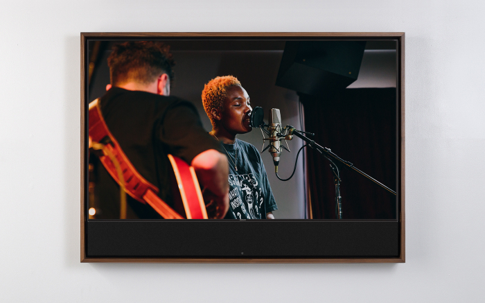 A Frame TV set into a hardwood Leon frame with an integrated soundbar, mounted on a wall