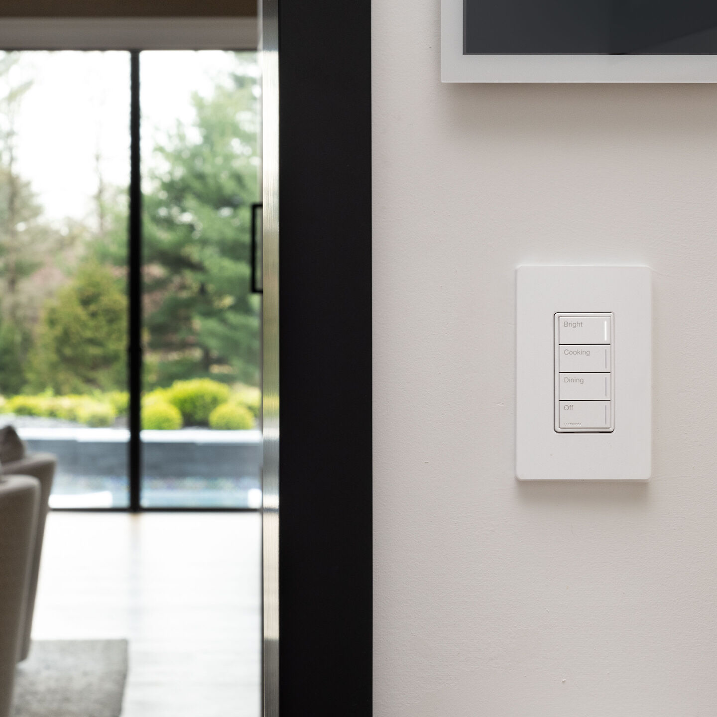 A Lutron engraved keypad with Bright, Cooking, Dining and Off scenes